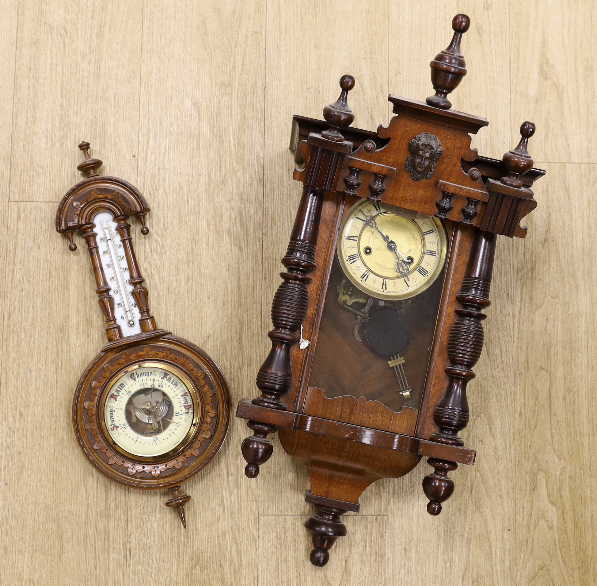 A mahogany Vienna wall clock and an aneroid barometer